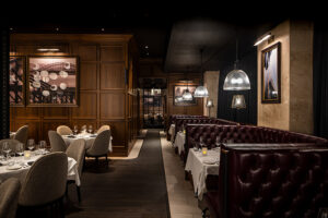 Del Frisco's Double Eagle Steakhouse dining room featuring luxe banquettes and intimate lighting
